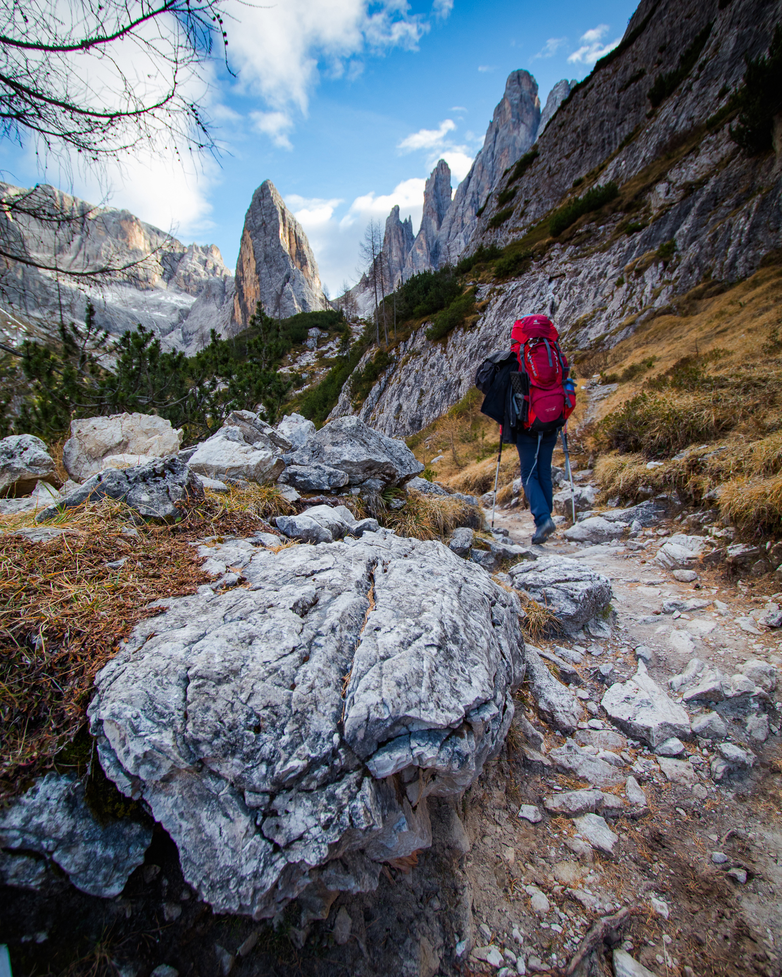 Woman hiking in the Dolomites with a Deuter SL 60 backpack